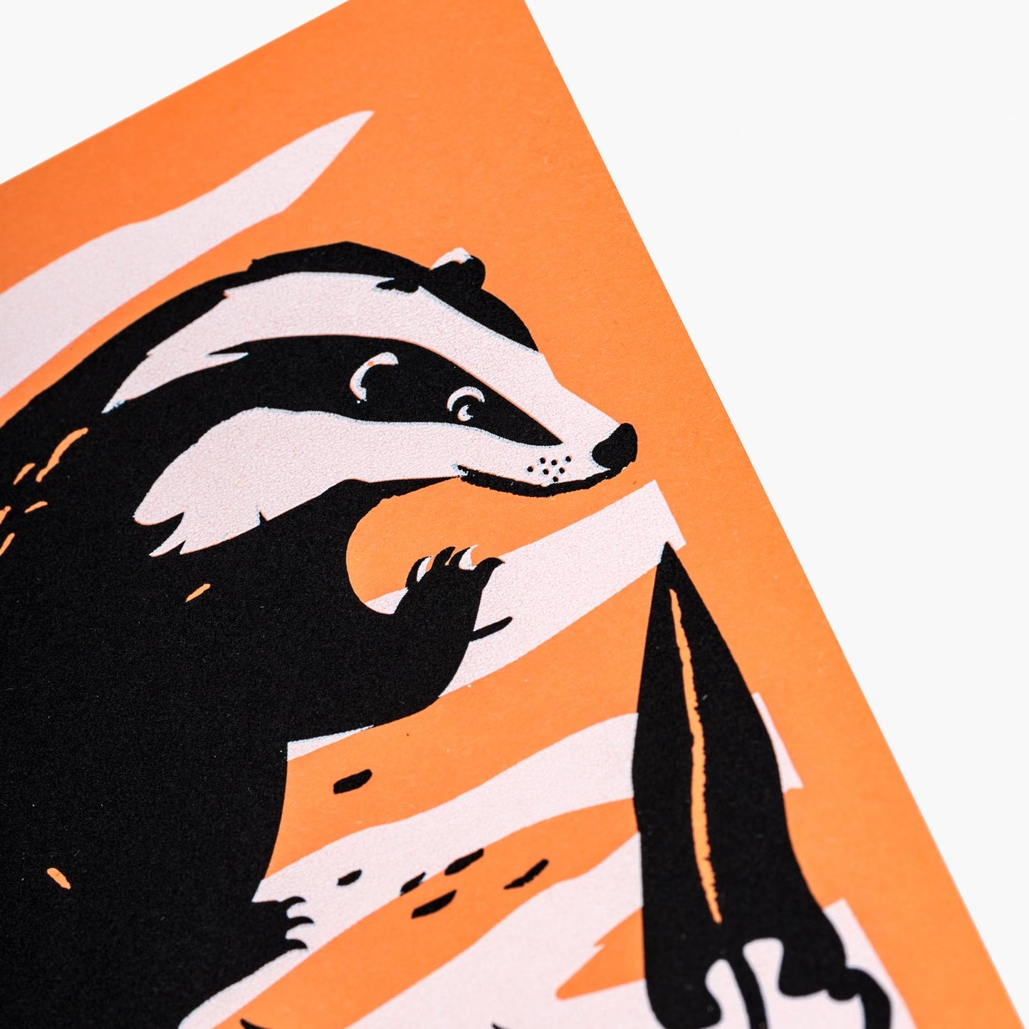 badger screen printed greeting card in orange black and white by pirrip press