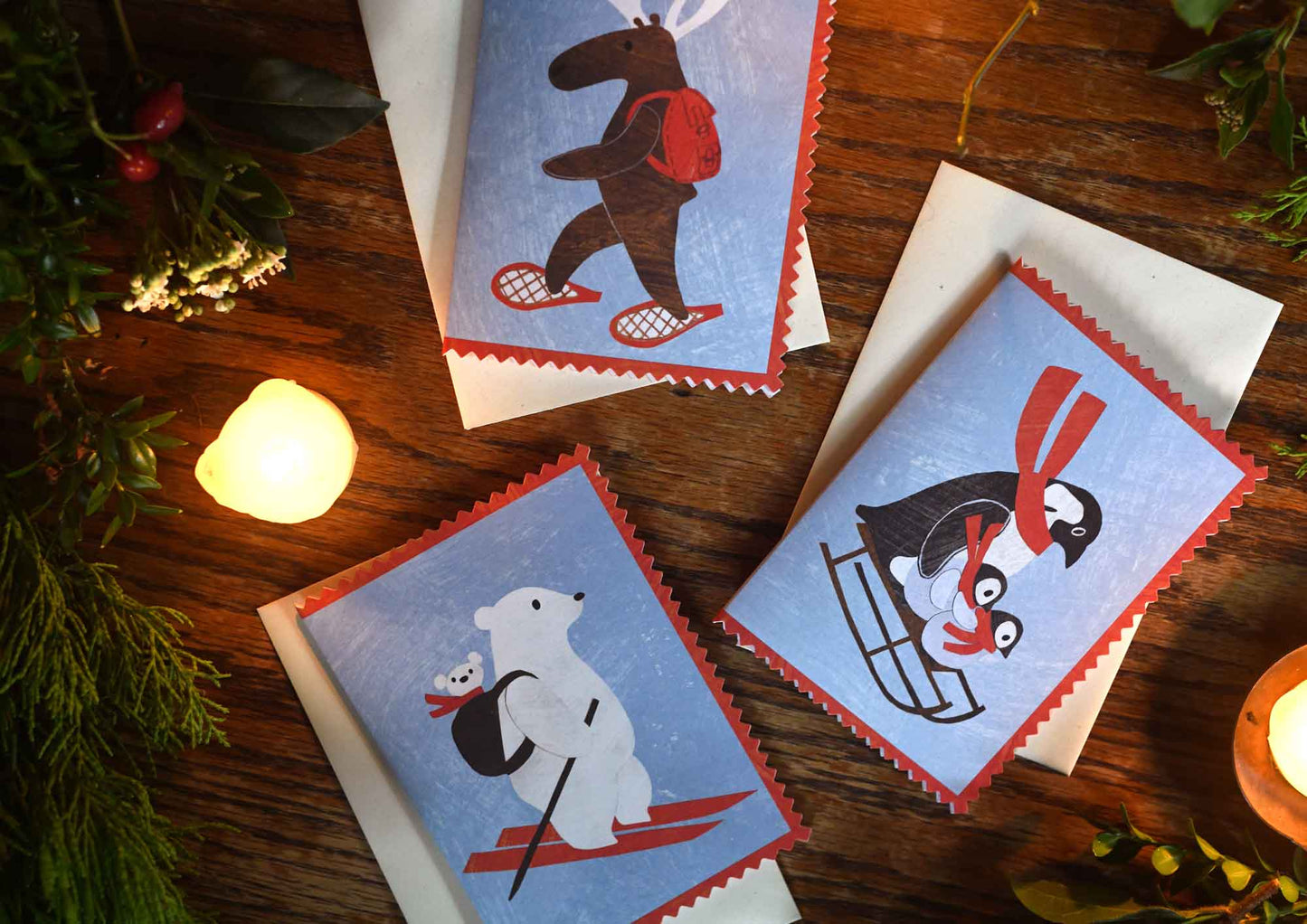 Mortlake papers christmas cards showing penguins, mama bear and moose designs with rick rack edges and made from collages by Alice Lickens