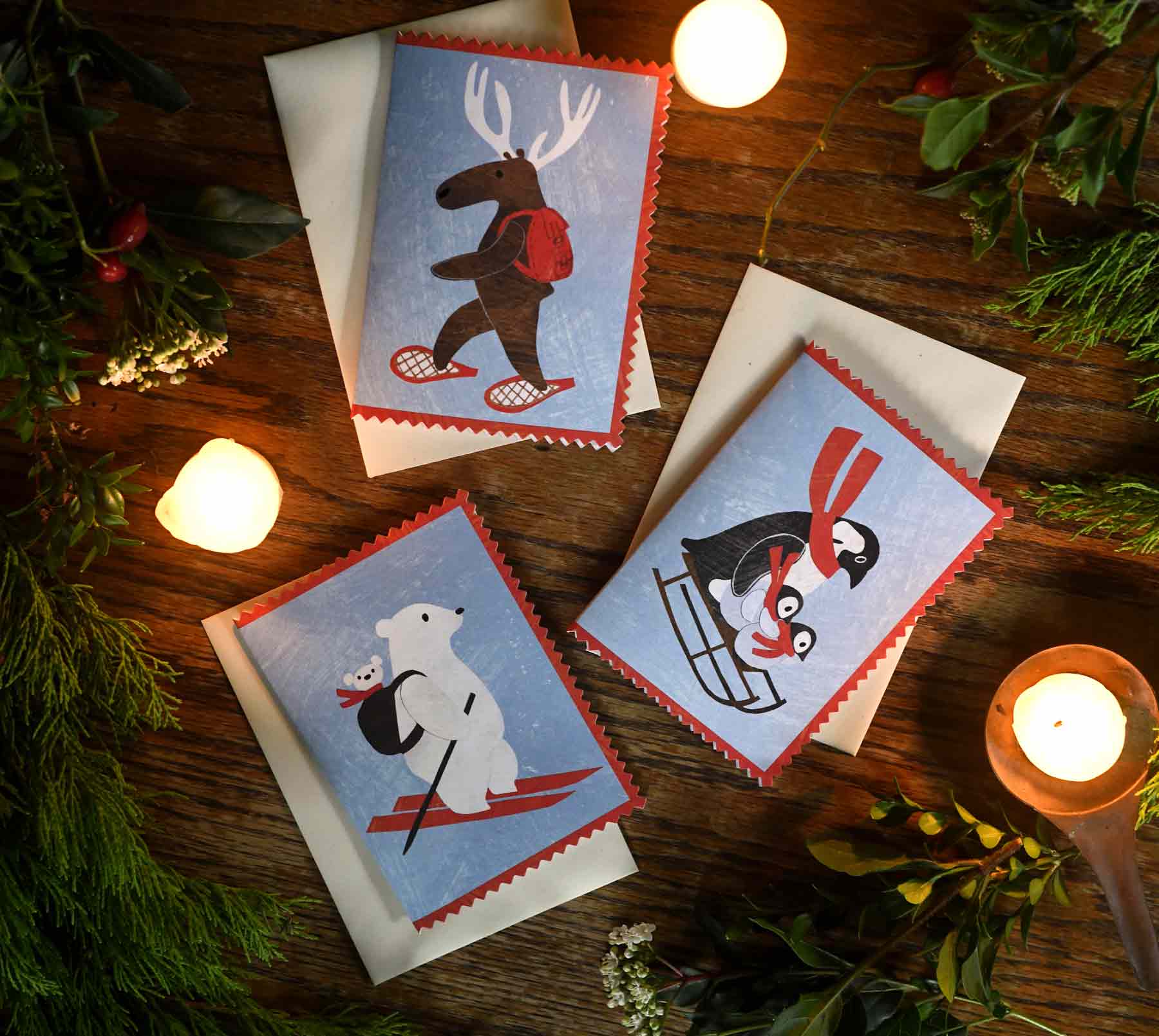 Mortlake papers christmas cards showing penguins, mama bear and moose designs with rick rack edges and made from collages by Alice Lickens