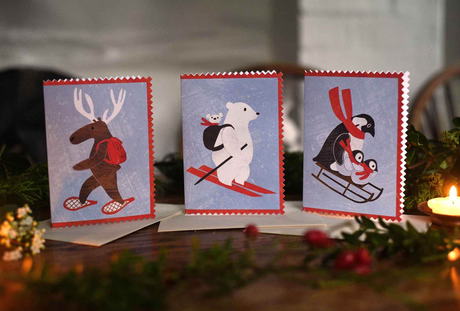 Mortlake papers christmas cards showing penguins, mama bear and moose designs with rick rack edges and made from collages by Alice Lickens
