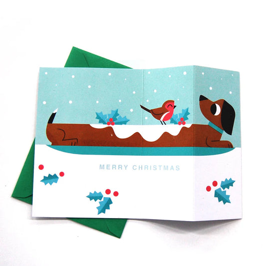 Yule Log sausage dog Christmas card by Peski Studio.