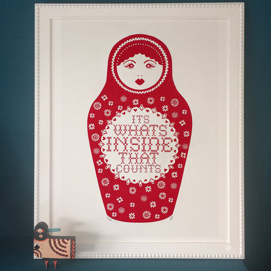 red russian stacking doll with text saying it's what's inside that counts original art screen print by Hazel Nicholls