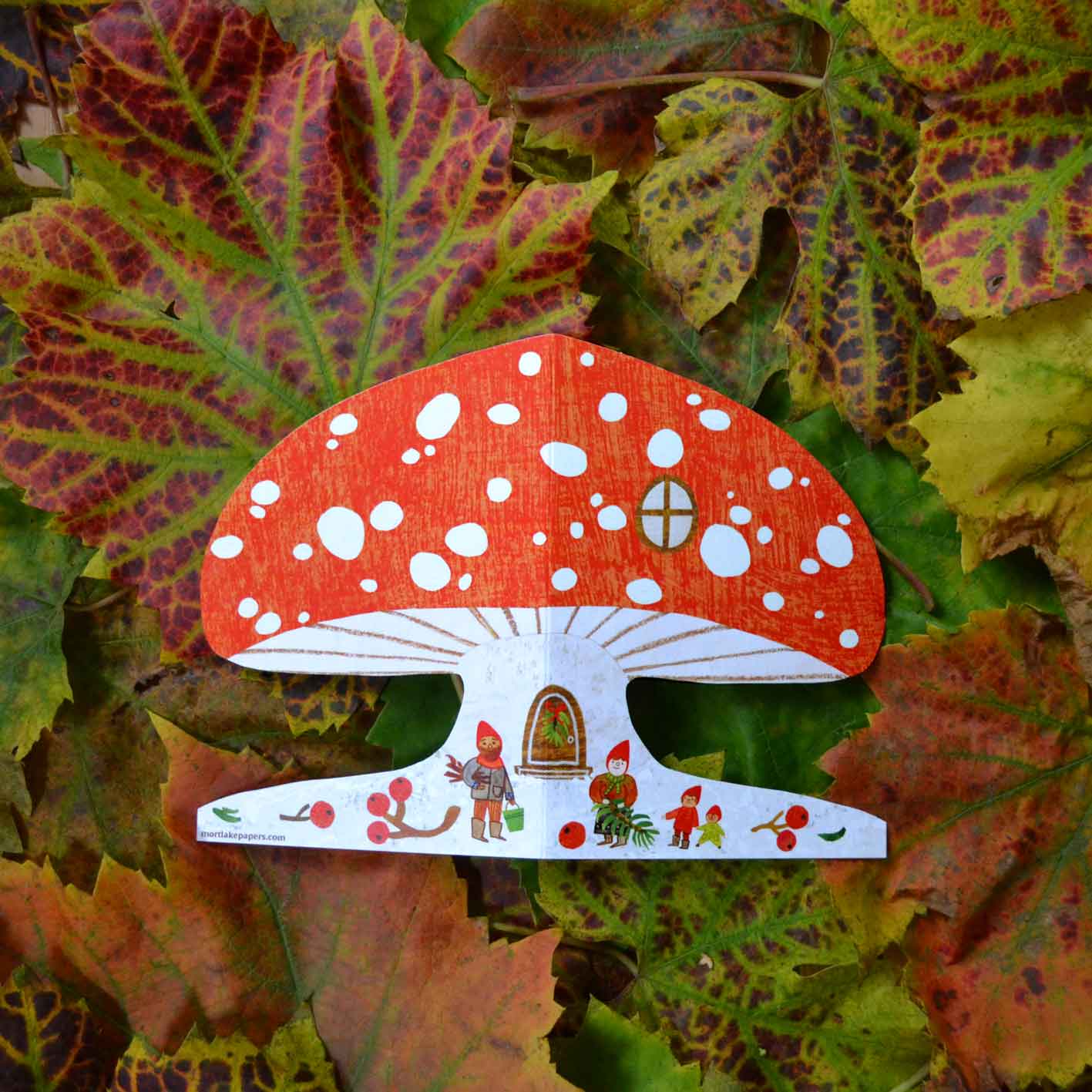 Snowy red mushroom house winter scene christmas card