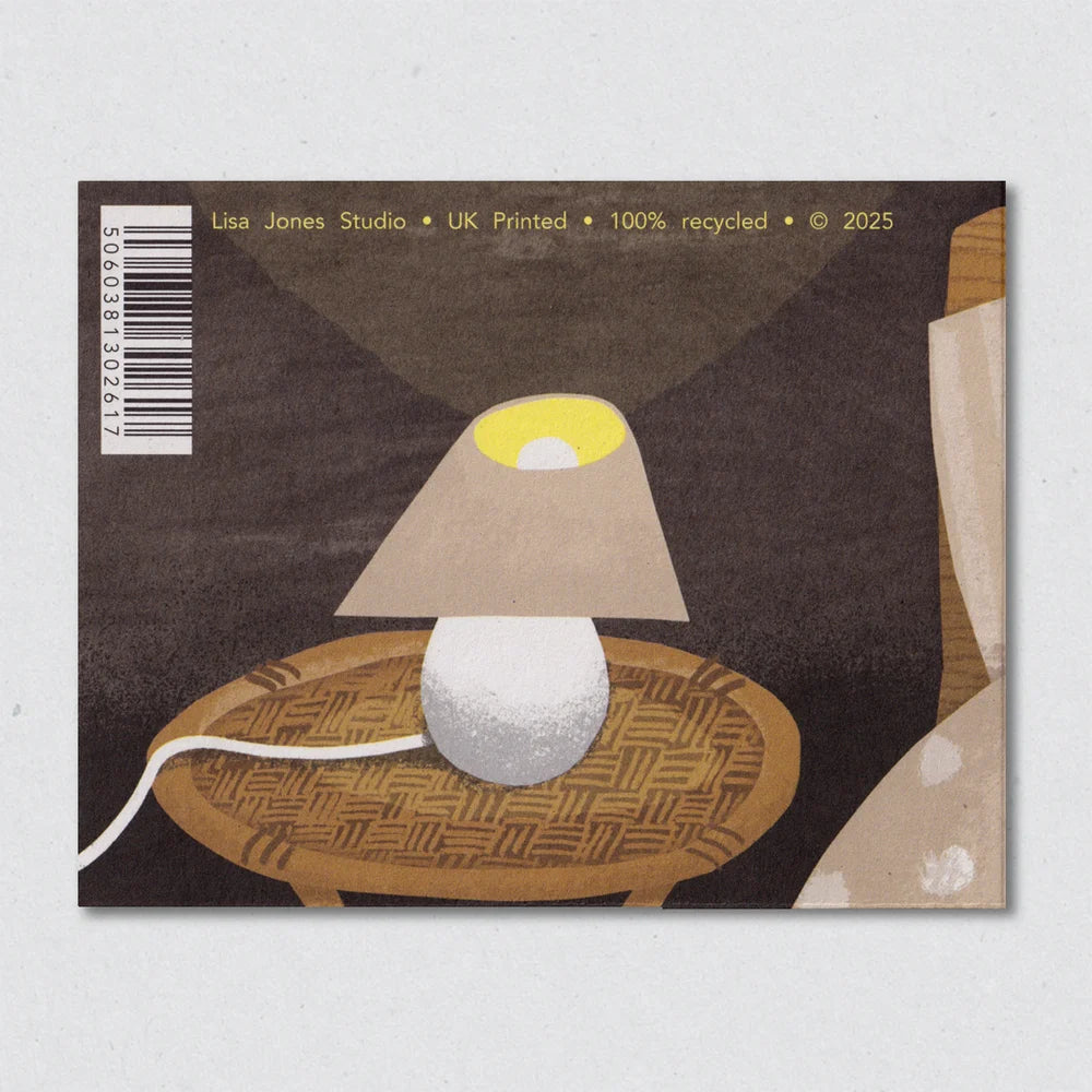 Card with a lamp illustration and text on a gray background by Lisa Hones Studio.