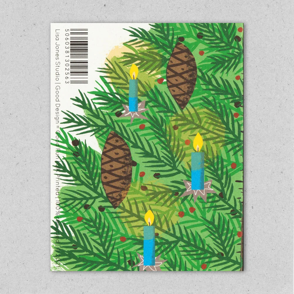 Card with Christmas design featuring greenery, candles, and pinecones on a gray background  by Lisa Jones Studio.