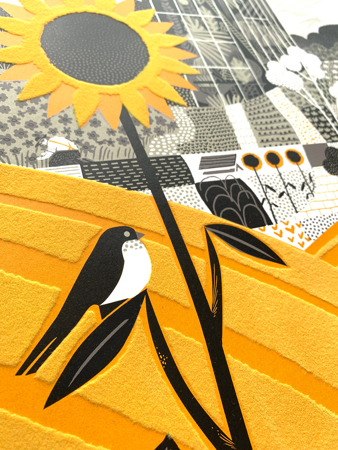 Hothouse Alice screen print and flocking by Graham Carter featuring a greenhouse, sunflower, fields, hills and a bird.