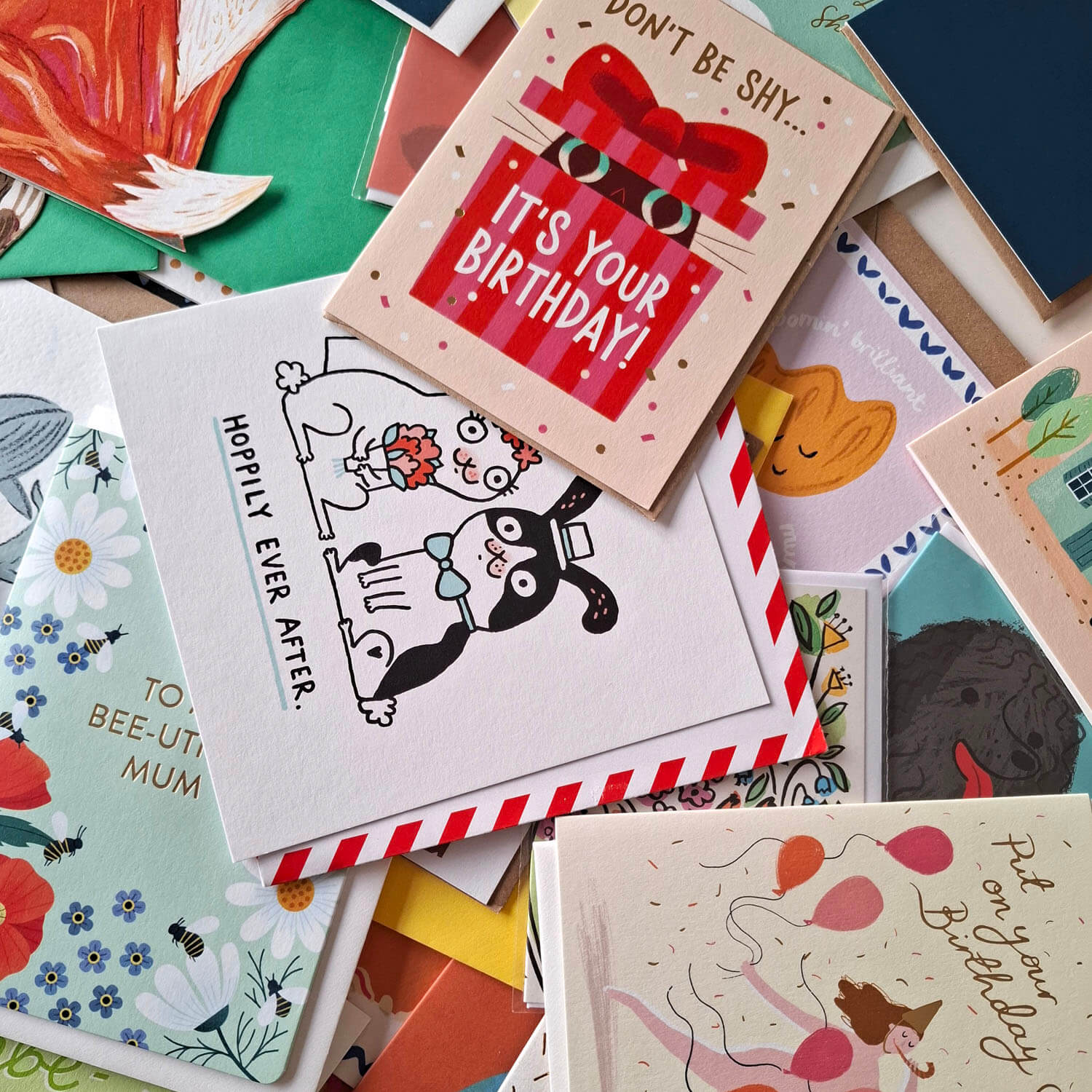 Collection of various greeting cards with different designs and messages.
