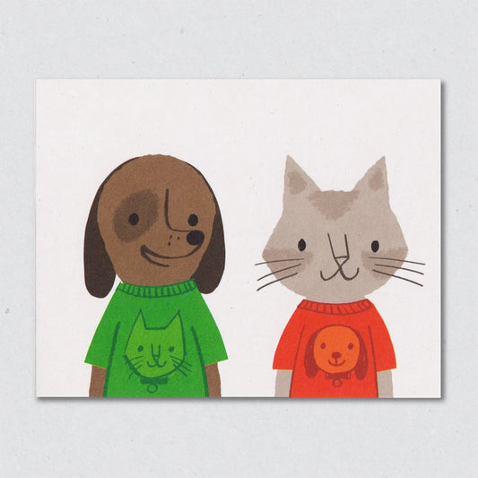 Mutual Appreciation greeting card by Lisa Jones Studio featuring an illustration of a dog and a cat wearing sweaters on a white background.