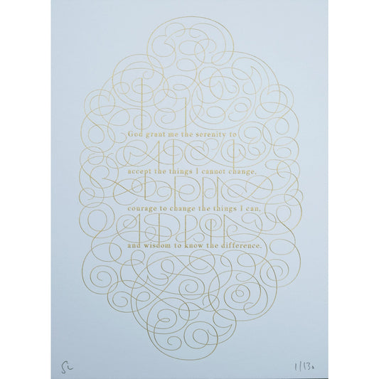The serenity prayer die stamp print by Seb Lester in gold on white. Features text: "god grant me the serenity to accept the things I cannot change, courage to change the things I can and wisdom to know the different. Type in ornate font and flourishes and swirls around the text.