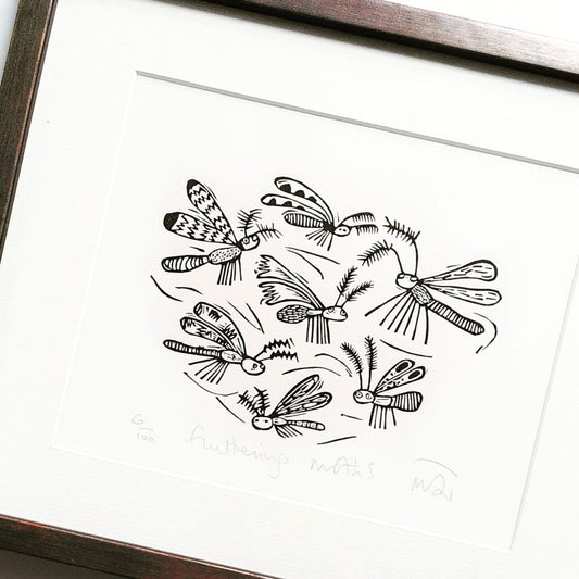 Fluttering moths linocut print by Melanie Wickham.