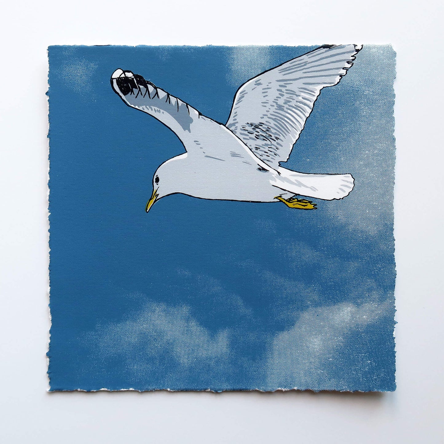 Flying gull by Fiona Hamilton featuring a seagull on a sky with clouds.