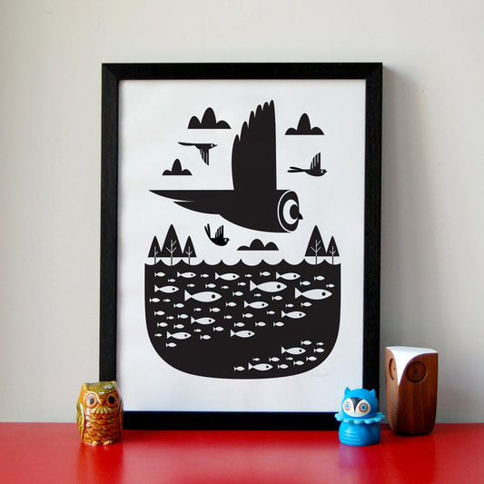 A black and white silkscreen print featuring an owl and a school of fish, signed by the artist, displayed unframed by Peski Studio.