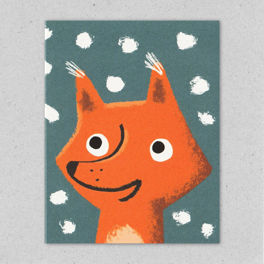 Snowflurry fox christmas card by Lisa Jones Studio featuring an orange fox on a grey background with snowflakes.