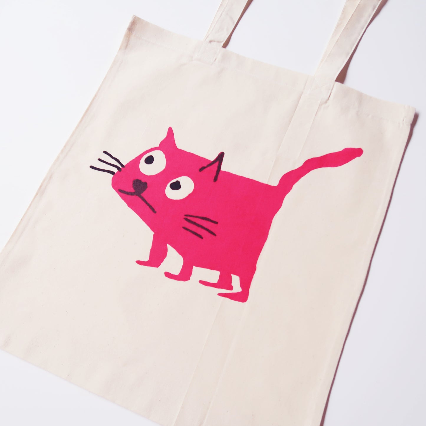 Cat pink tote bag screen printed onto cotton from a collaboration between Daisy Hirst and Soma Gallery.
