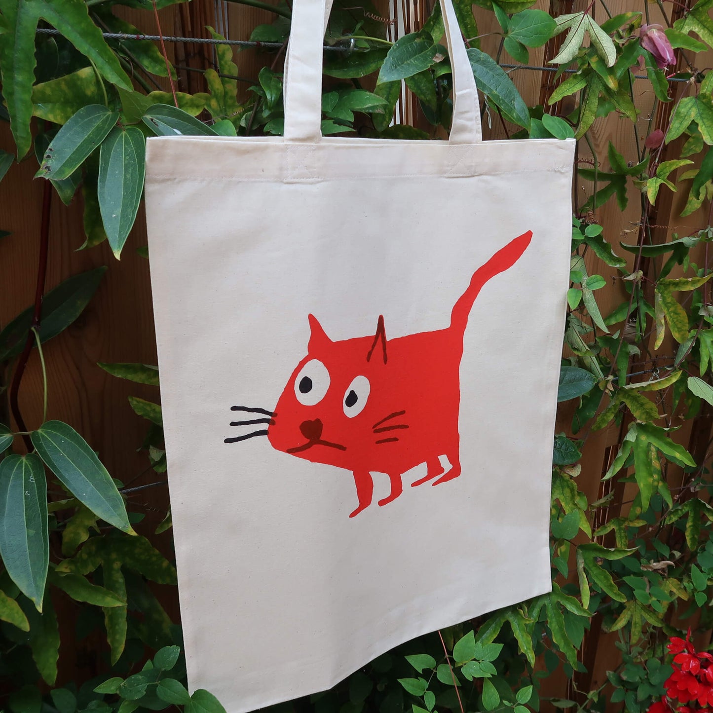Cat red tote bag screen printed onto cotton from a collaboration between Daisy Hirst and Soma Gallery.