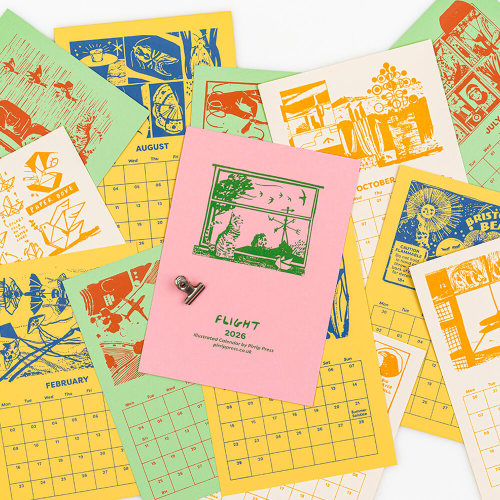 Colorful calendar pages laid out with a pink front cover titled 'FLIGHT' in the center, hand screen printed by illustrators and printmakers, Pirrip Press featuring illustrations based on flight theme and made in Bristol.