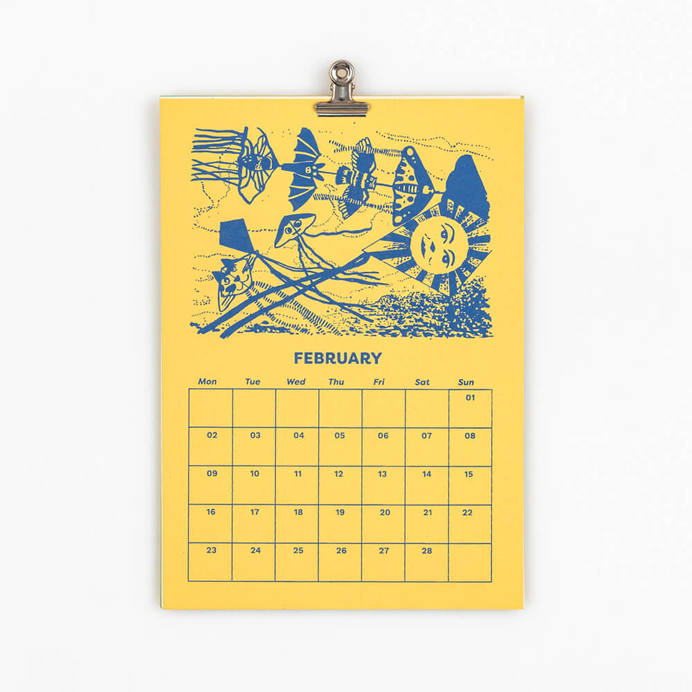 Calendar page for February with blue illustrations of kites on a yellow background of Flight 2026 illustrated calendar by Pirrip Press, screen printed by hand in Bristol.