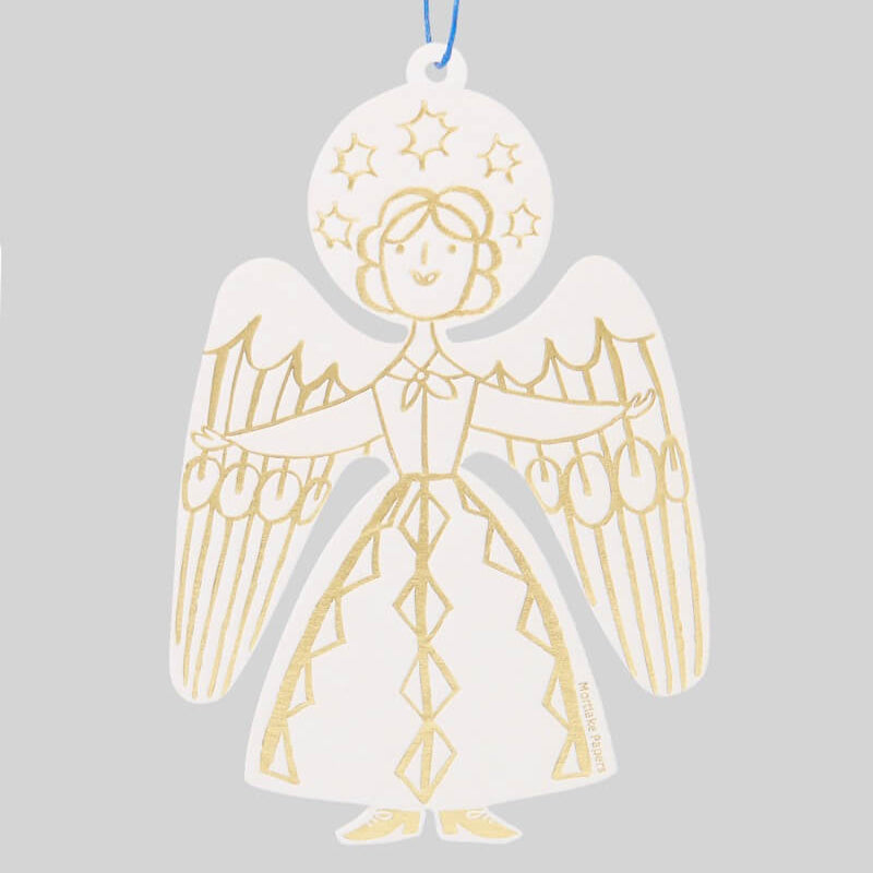 Gold angel Christmas ornament on a gray background by Mortlake Papers