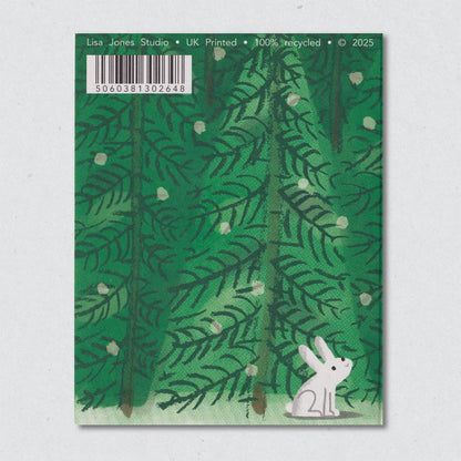 The reverse of the Abominable Snowman Christmas Card by Lisa Jones Studio illustrating a white creaturerabbit against a green leafy background
