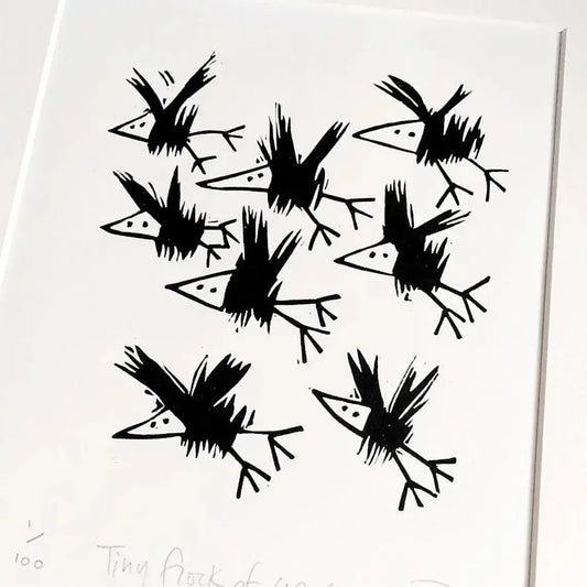 Black lino cut print of crow birds on a white background by Printmaker Melanie Wickham.