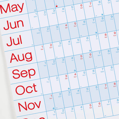Crispin Finn's Year Planner Calendar for 2026 with red text showing months from January to December on a white and light blue background.