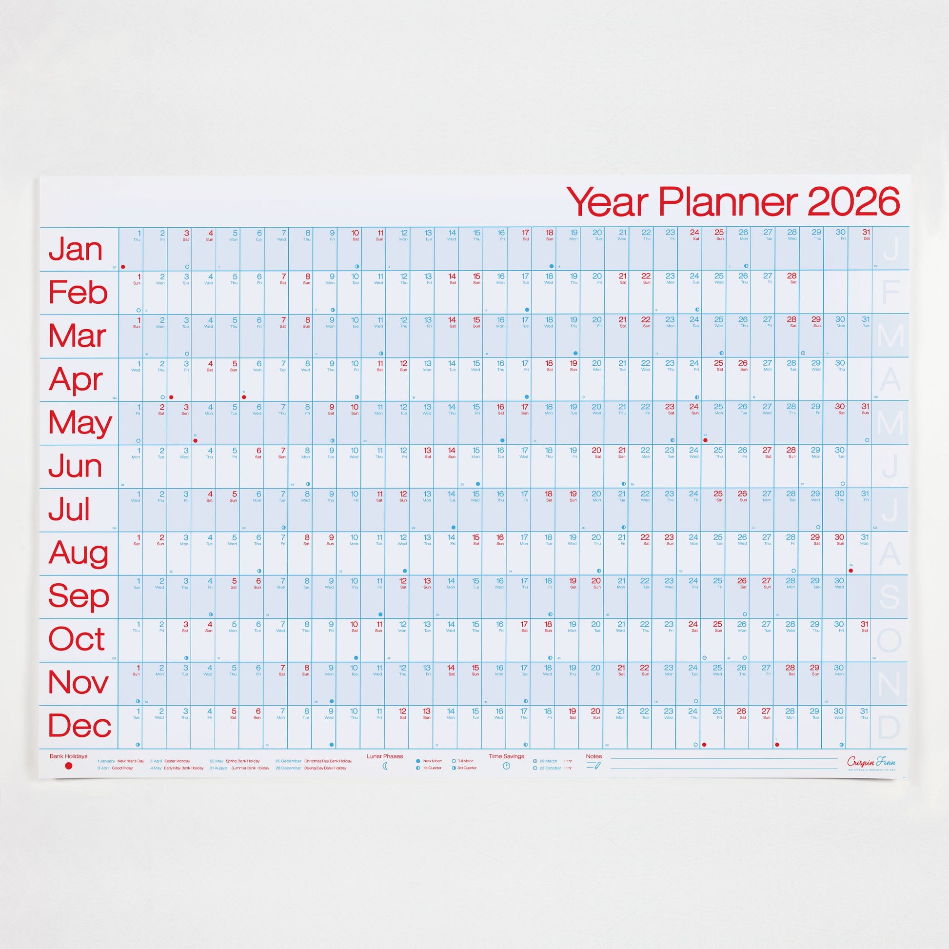 Crispin Finn's Yearly wall planner for 2026 with a light blue grid on a white background and red and blue text in a graphic style.